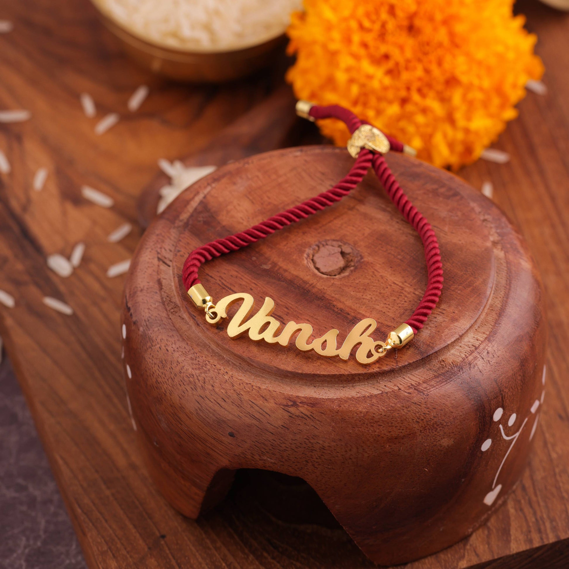 Personalized Rakhi Knotted In Marron Thread