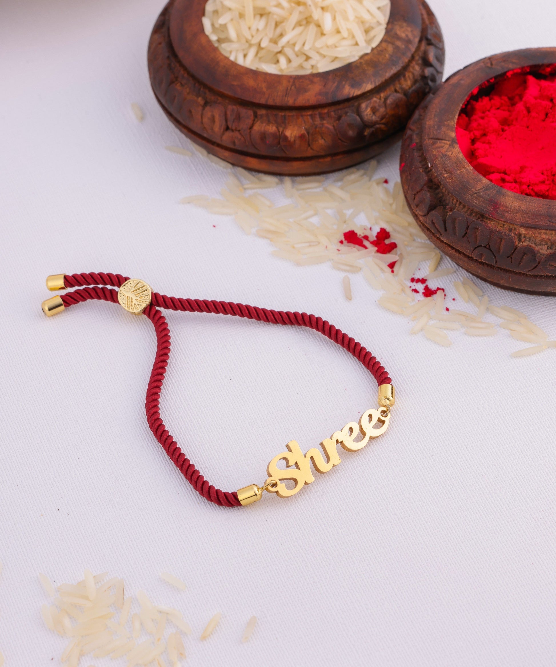 Personalized Rakhi Knotted In Marron Thread